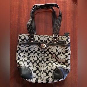 Black and gray Coach shoulder bag.